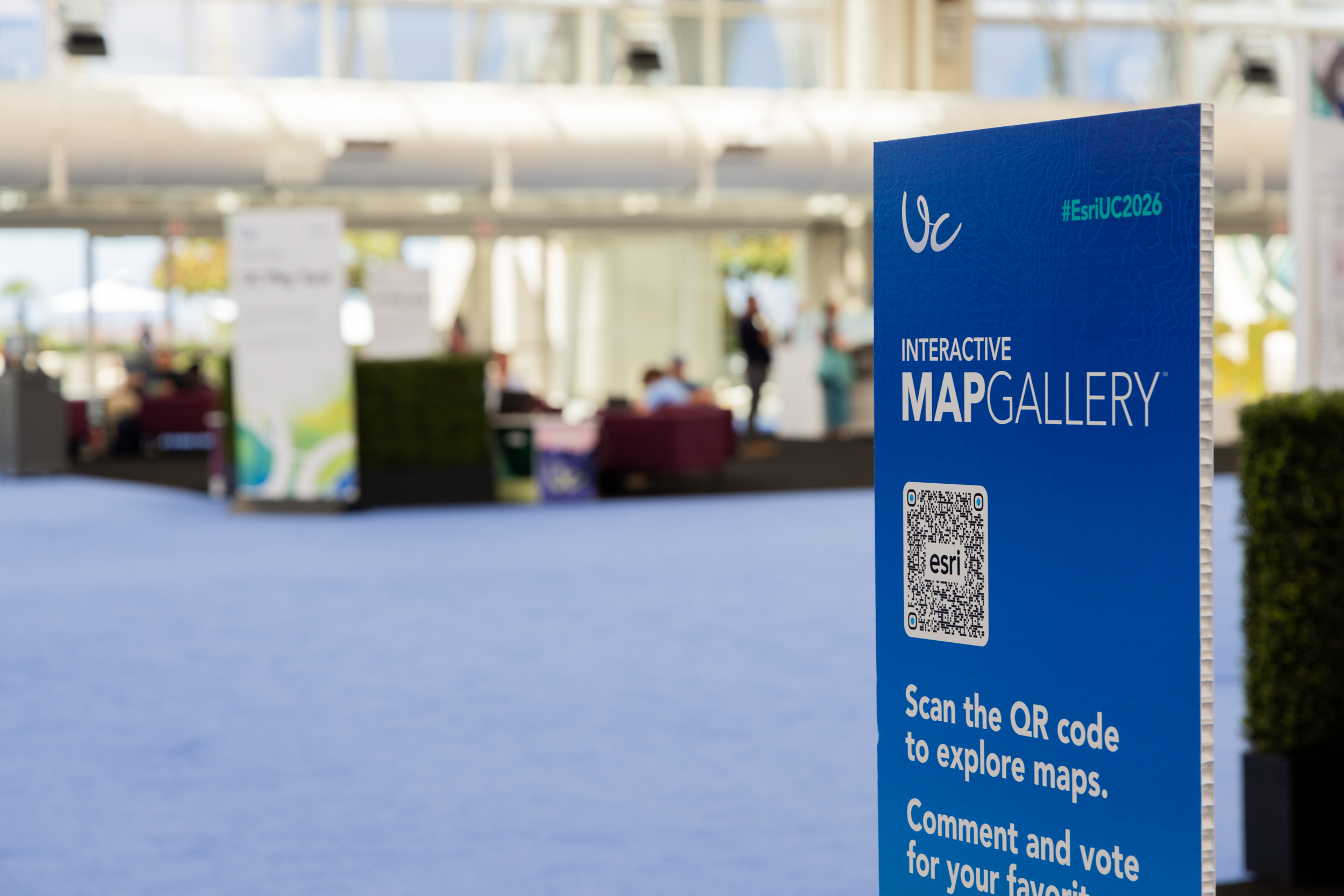 Signage pointing attendees to the gallery with QR code